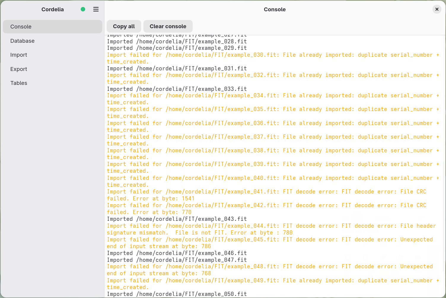 Console output showing orange warning lines for files that failed to import, some
        because they were already imported previously and some with FIT decode errors, interleaved
        with normal black-text import lines.