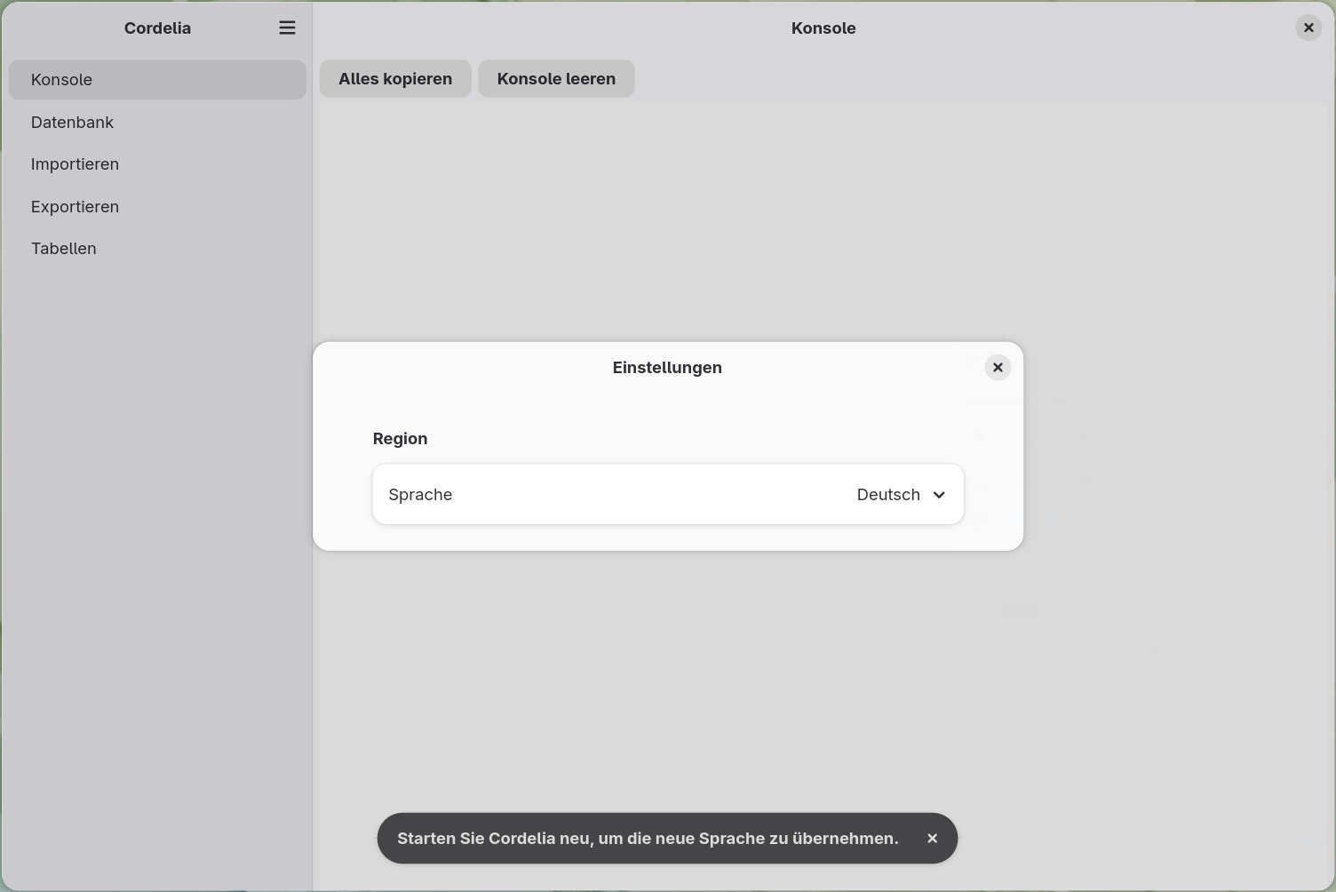 Der Dialog Einstellungen mit einem Abschnitt Region und einem Sprachauswahlmenü,
        eingestellt auf Englisch.