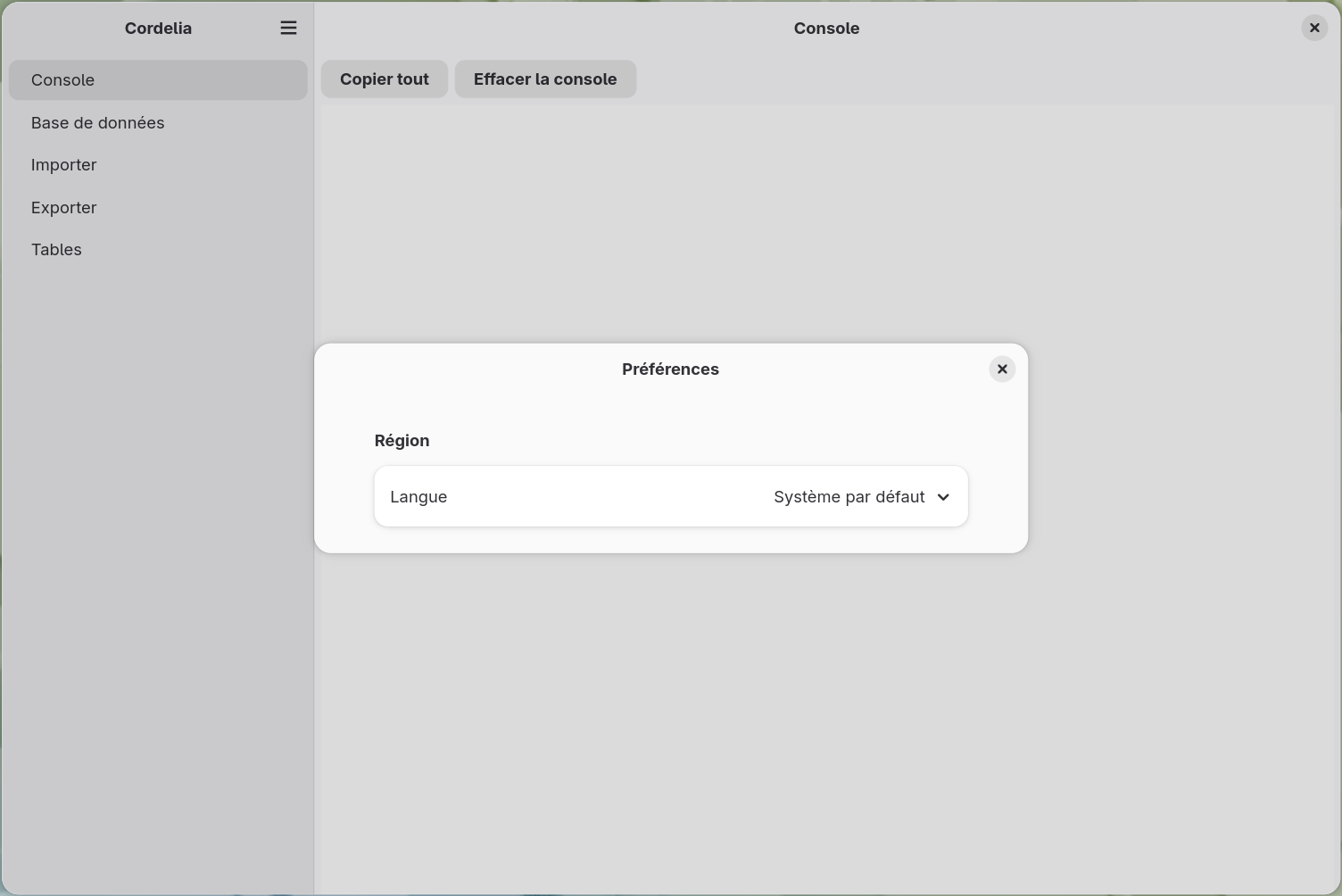 La boîte de dialogue Préférences, avec une section Région et un menu déroulant de
        langue réglé sur l'anglais.