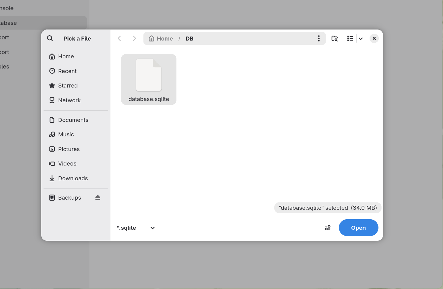 The same dialog with database.sqlite selected in a DB folder, and the Open button now
        active.