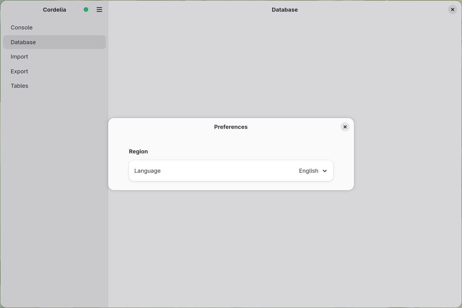The Preferences dialog, showing a Region section with a Language dropdown set to
        English.