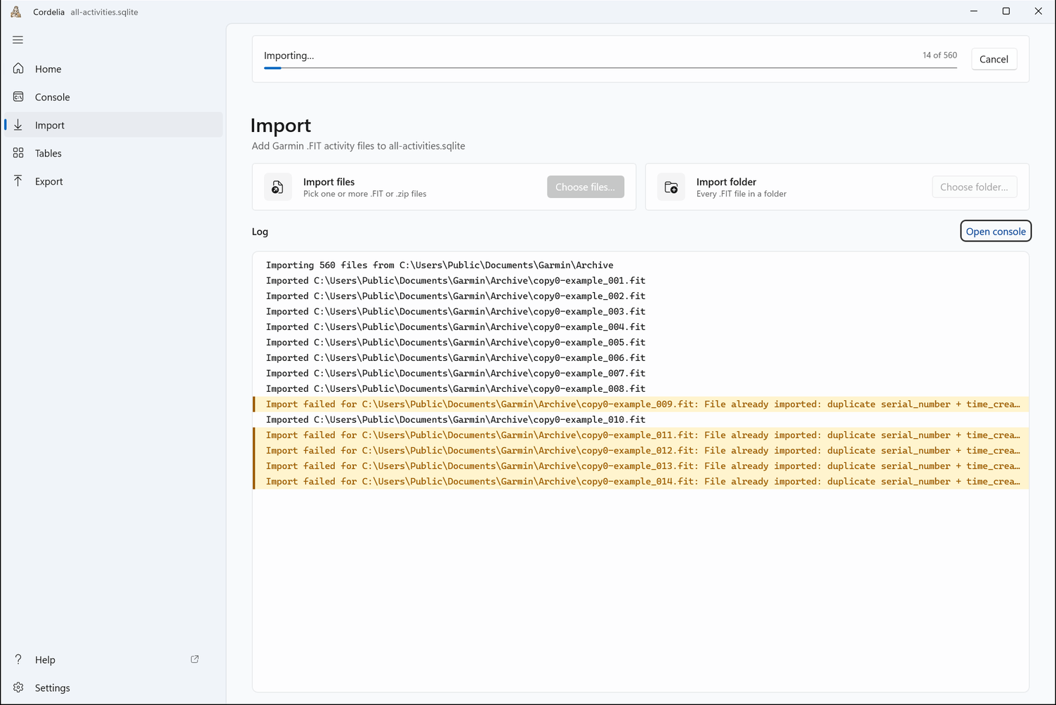 An import in progress: a progress bar reading 14 of 560, a Cancel button, and the log listing each file.